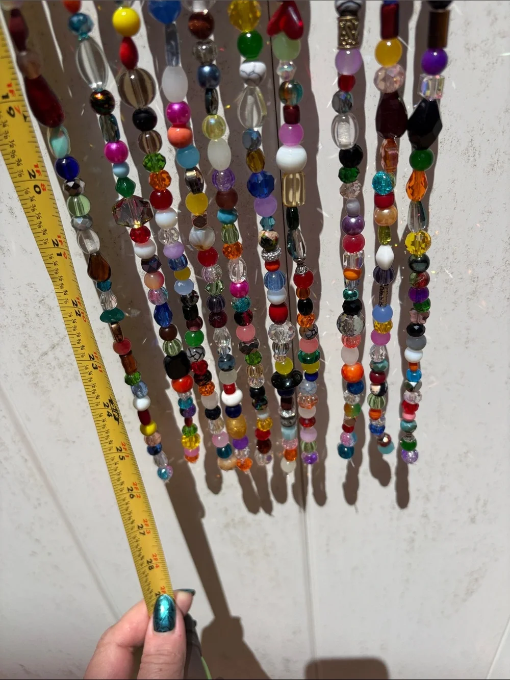 10 strands 26 inches long made with glass & crystal beads